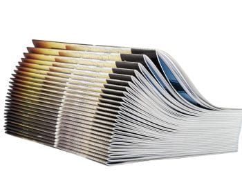 Pile of magazines isolated on white background